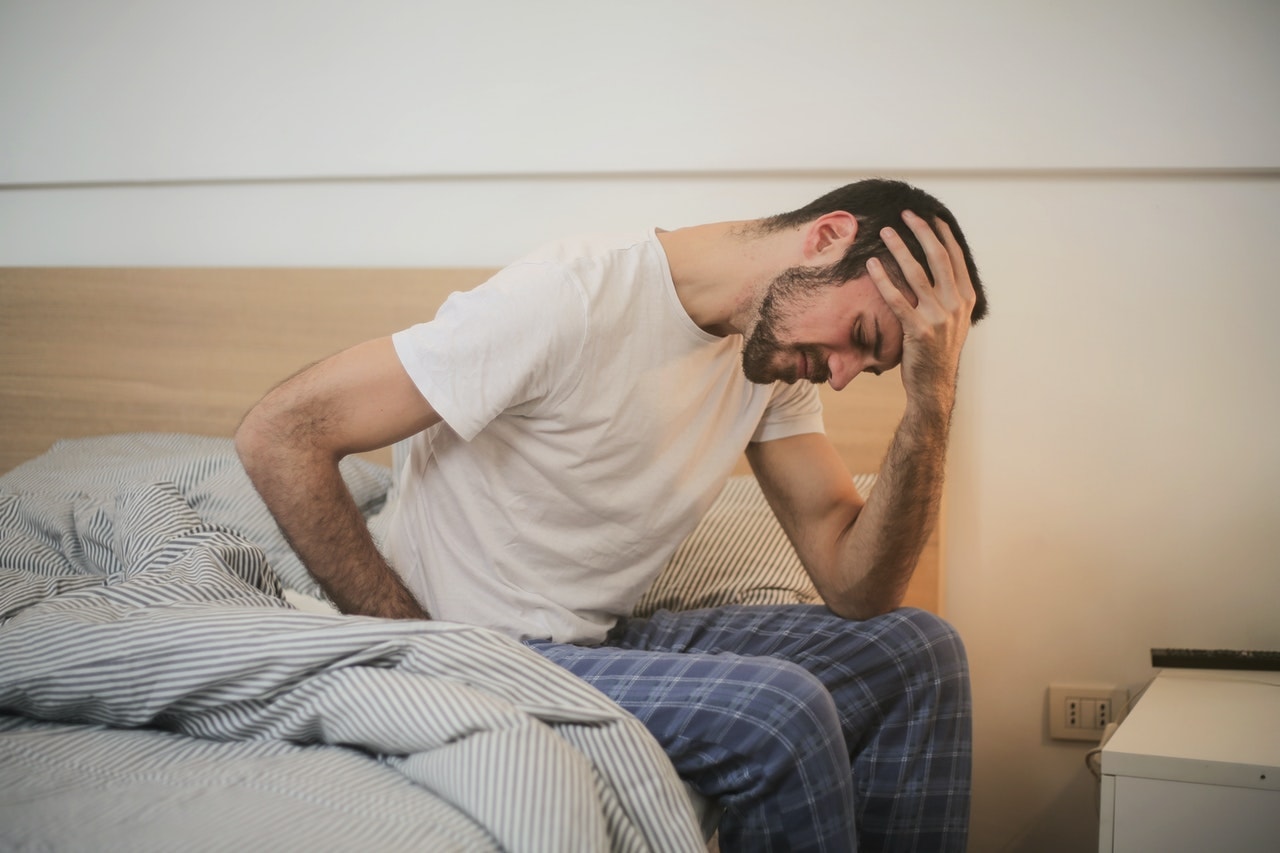 man with headache and alcohol use disorder